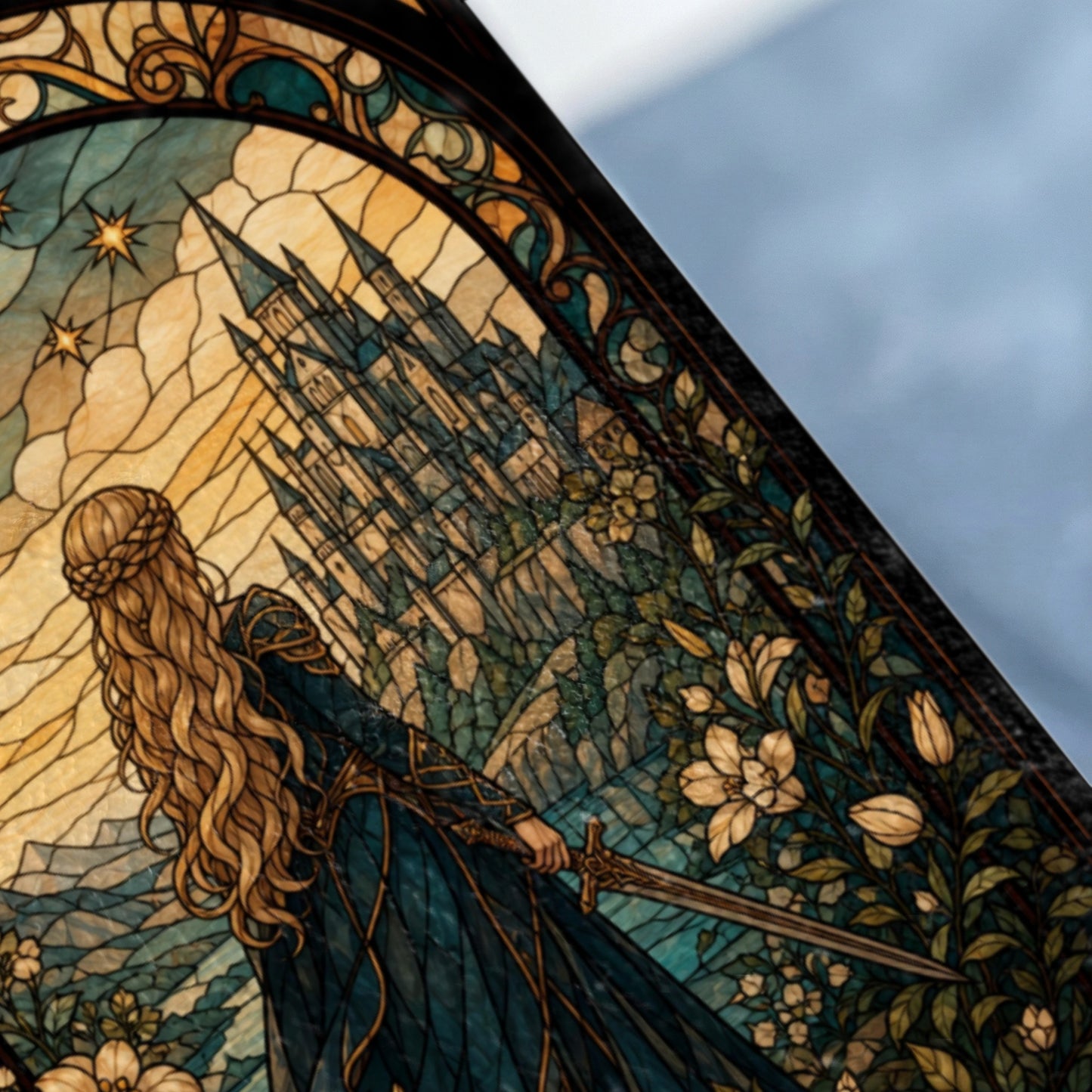 Stained glass depiction of a woman with a sword overlooking a castle.