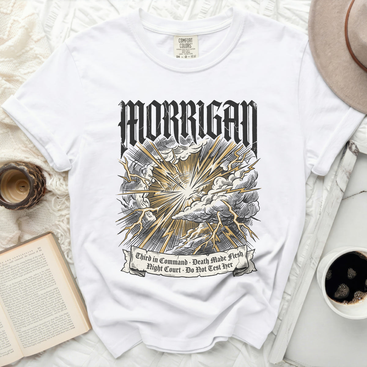 White t-shirt with "Morrigan" and lightning graphic, text "Third in Command", "Death Made Flesh", "Night Court", "Do Not Test Her".