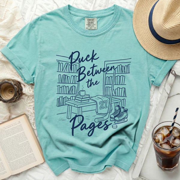 Puck Between the Pages Hockey Tee in Island Reef