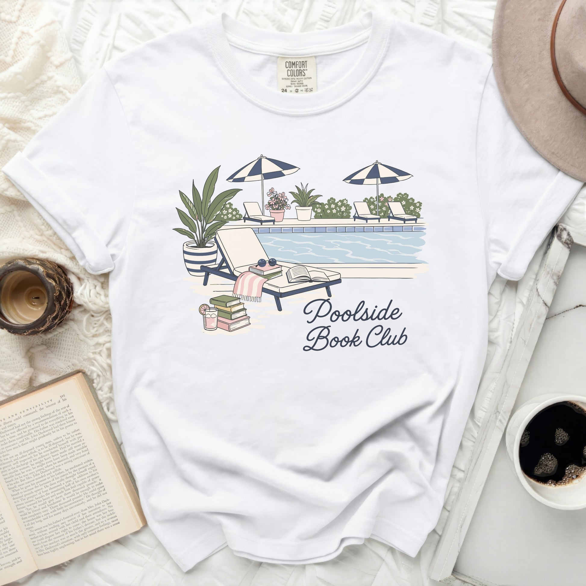 White t-shirt with "Poolside Book Club" text and poolside graphic.