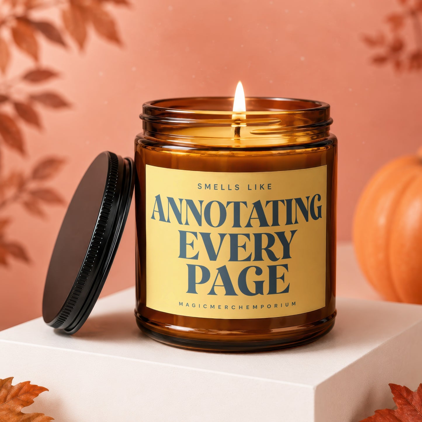 Amber glass candle with burning wick labeled "Smells Like Annotating Every Page".