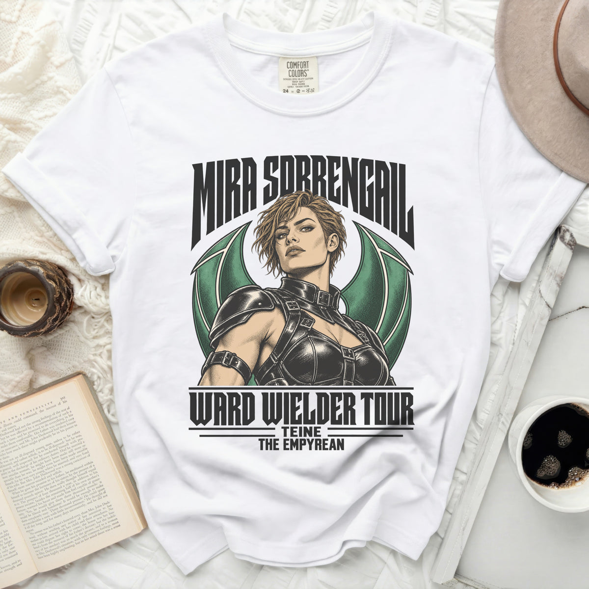 White t-shirt with "Mira Sobrengail Ward Wielder Tour" graphic and a stylized woman.