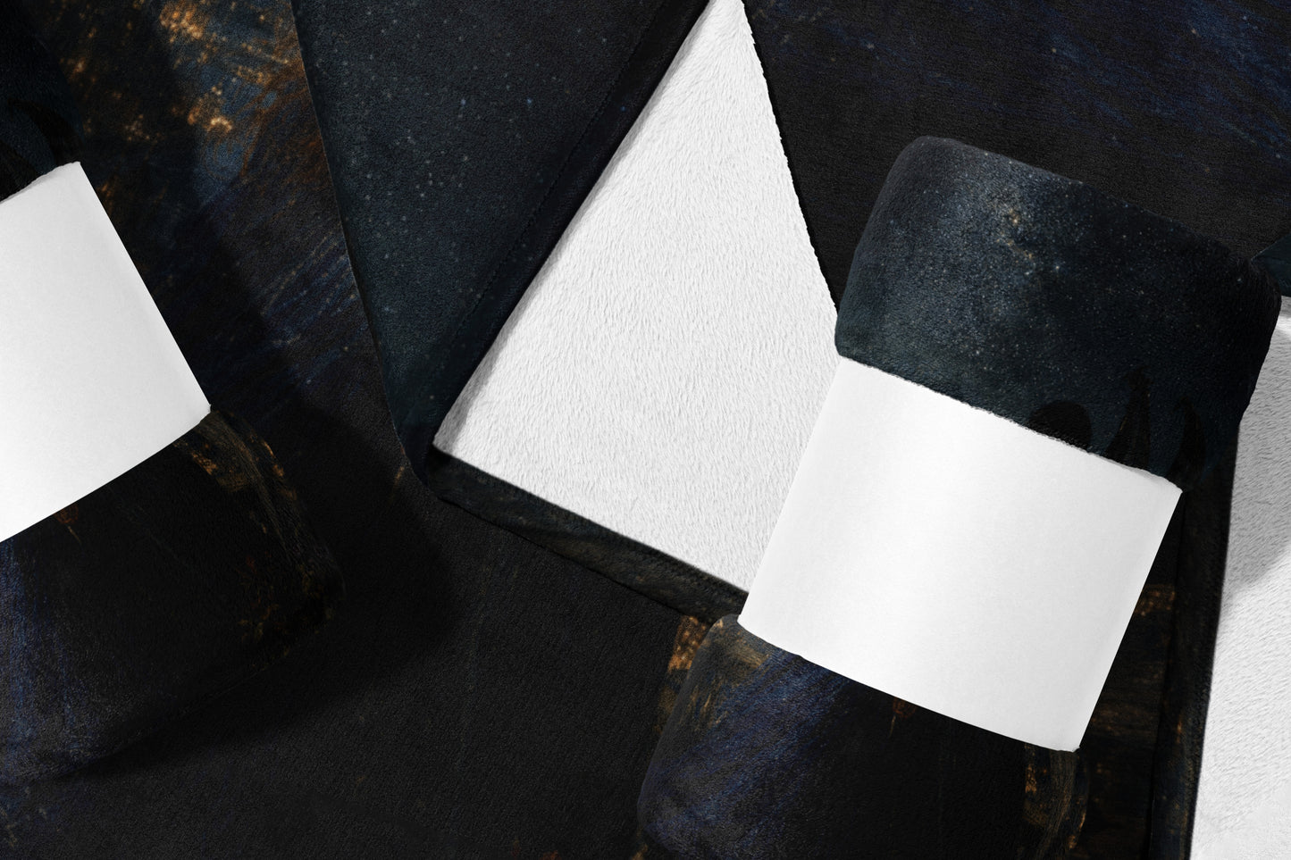 Dark abstract pattern on folded fabric with white insert.