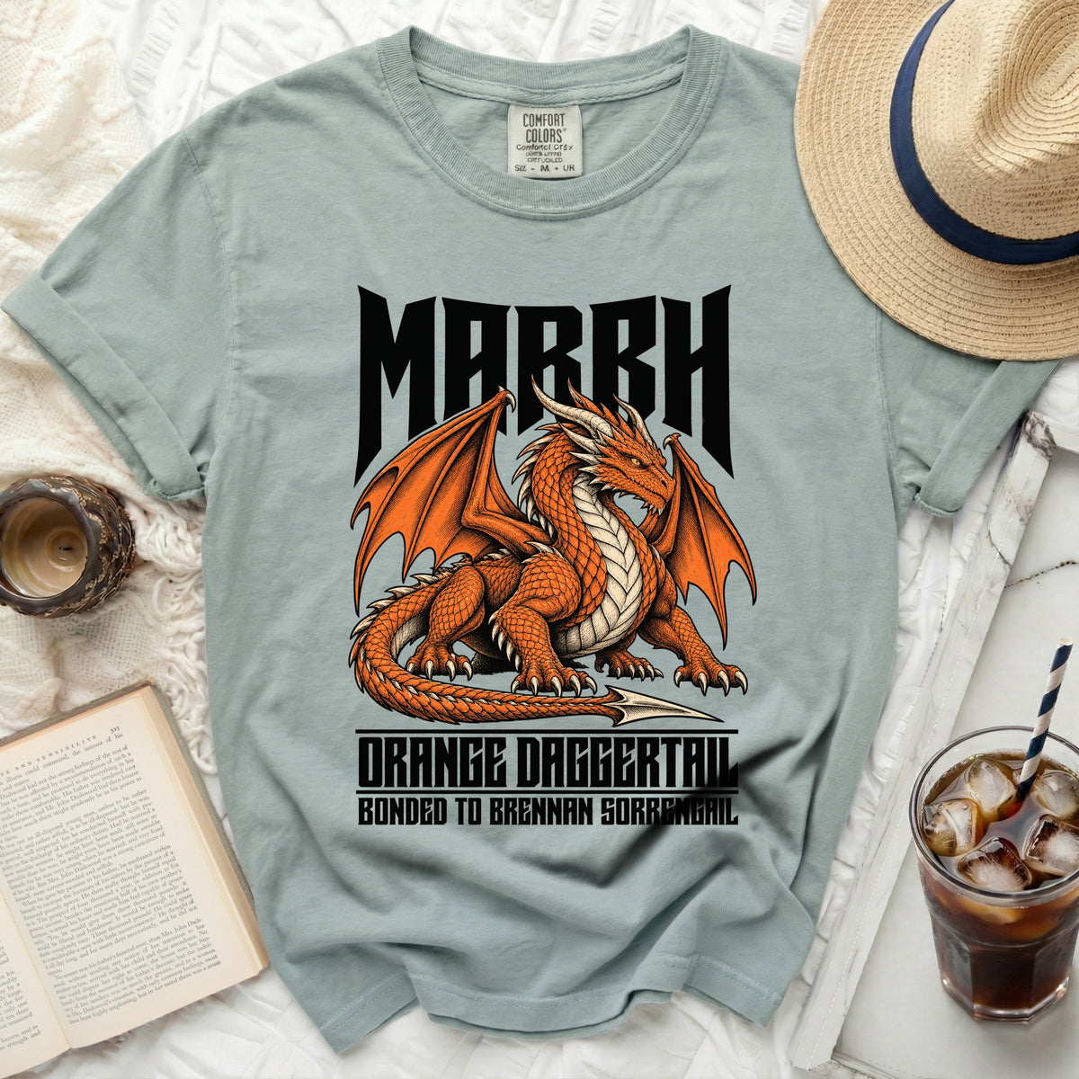 Light teal t-shirt with orange dragon graphic and text March Orange Daggertail.