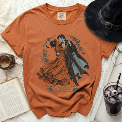 Orange t-shirt with vampire couple illustration and "Romance After Dark" text.