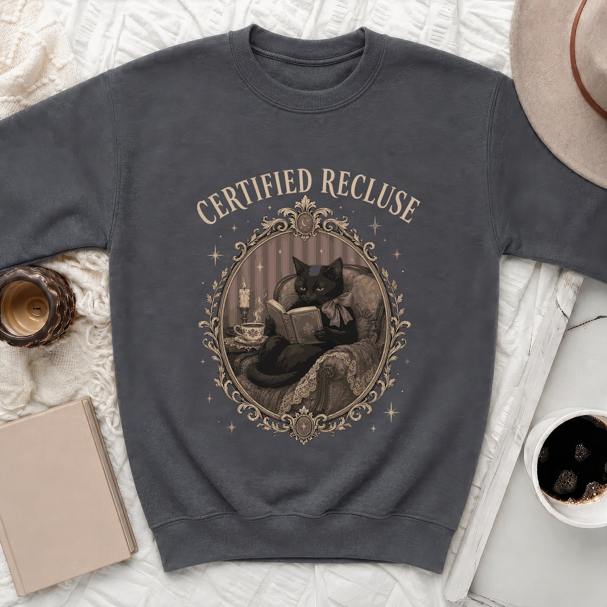 Dark gray sweatshirt with "CERTIFIED RECLUSE" text and a black cat reading a book.