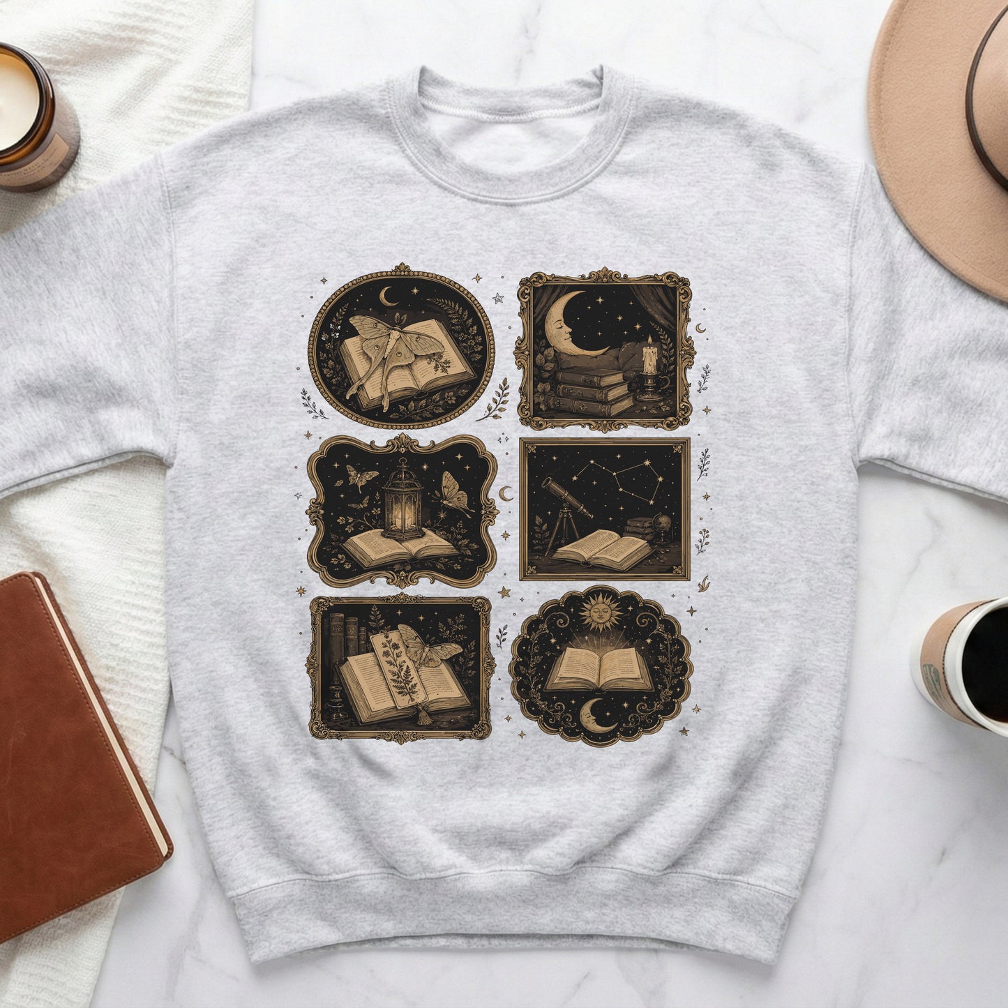 Light gray sweatshirt with a collage of five dark, ornate frames featuring celestial and literary imagery.