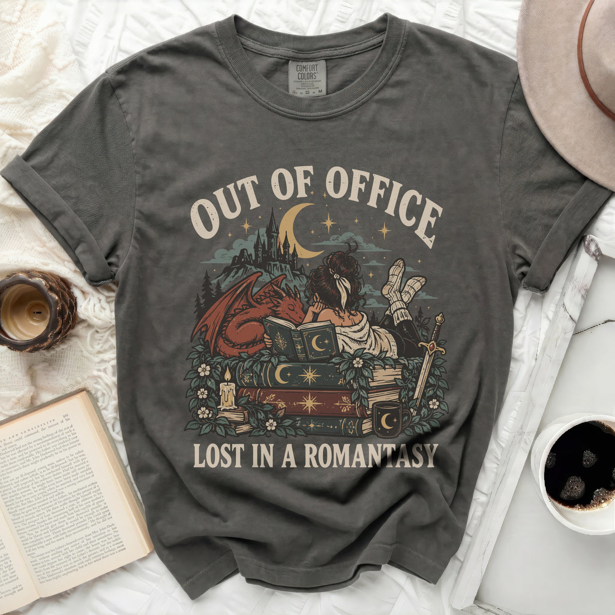 Out of Office Lost in a Romantasy t-shirt with dragon and castle graphic.