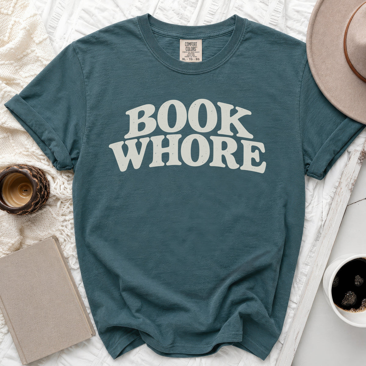Teal t-shirt with "BOOK WHORE" in distressed cream lettering.