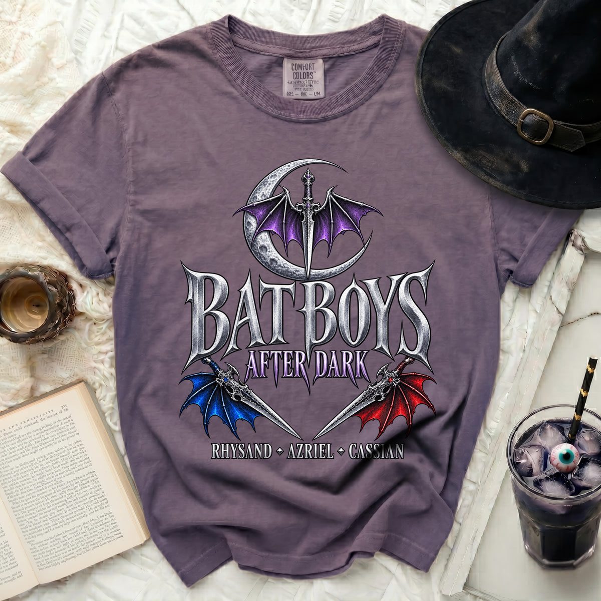 Purple t-shirt with "Bat Boys After Dark" text, moon, sword, and wings design.