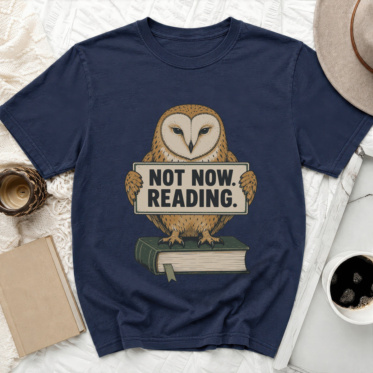 Barn owl graphic holding sign that says "Not Now. Reading." on a book.