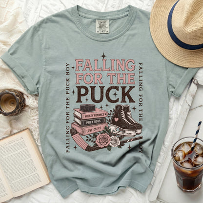 T-shirt with "Falling for the Puck Boy" text and hockey imagery.