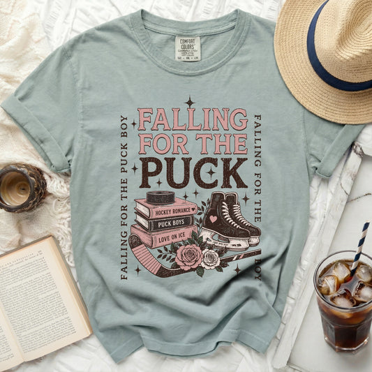 T-shirt with "Falling for the Puck Boy" text and hockey imagery.