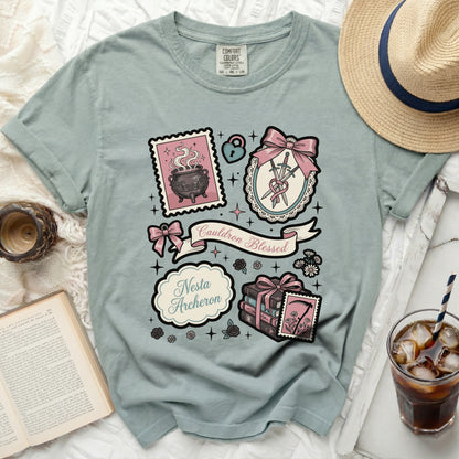 T-shirt with magical cottagecore designs and "Cauldron Blessed Nesta Archeron" text.