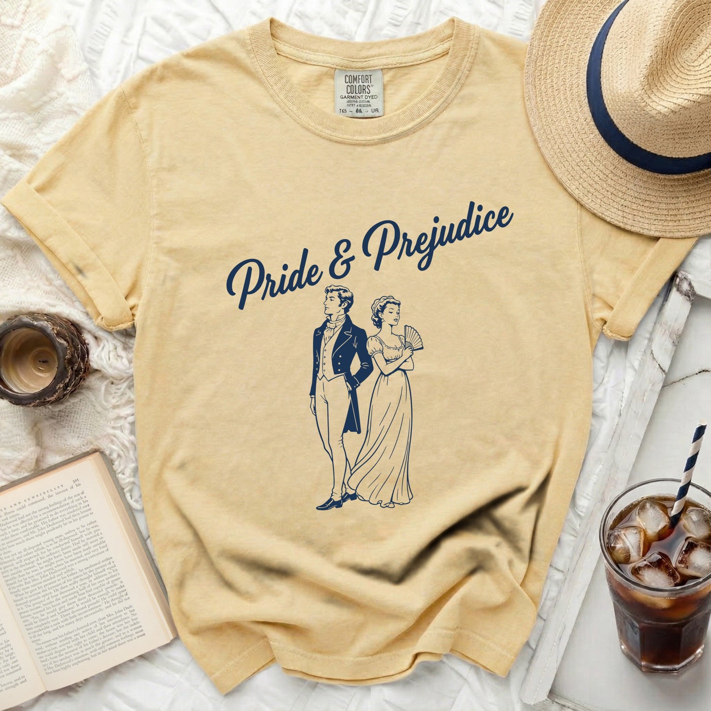 Yellow t-shirt with "Pride & Prejudice" and a couple illustration.