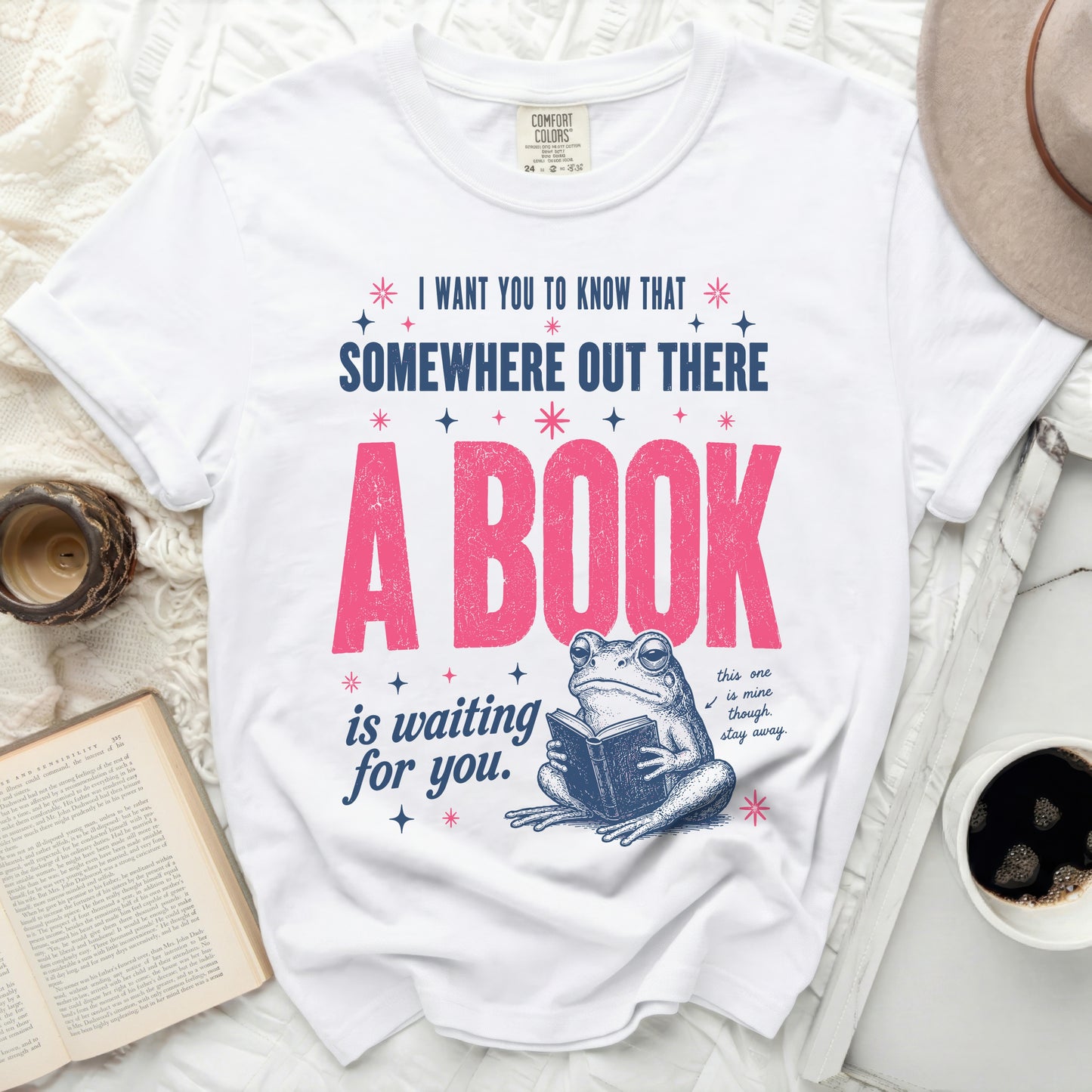 T-shirt with graphic: "A book is waiting for you. This one is mine though. Stay away."