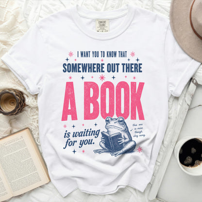 T-shirt with graphic: "A book is waiting for you. This one is mine though. Stay away."
