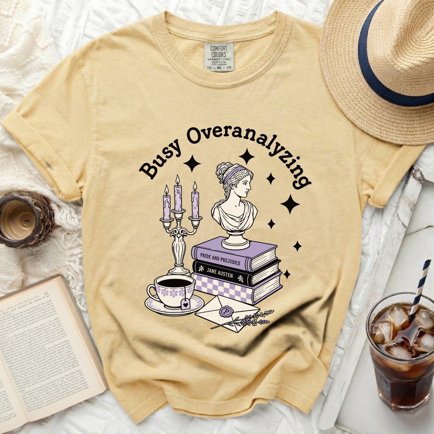 Yellow Comfort Colors t-shirt with "Busy Overanalyzing" and literary graphics.