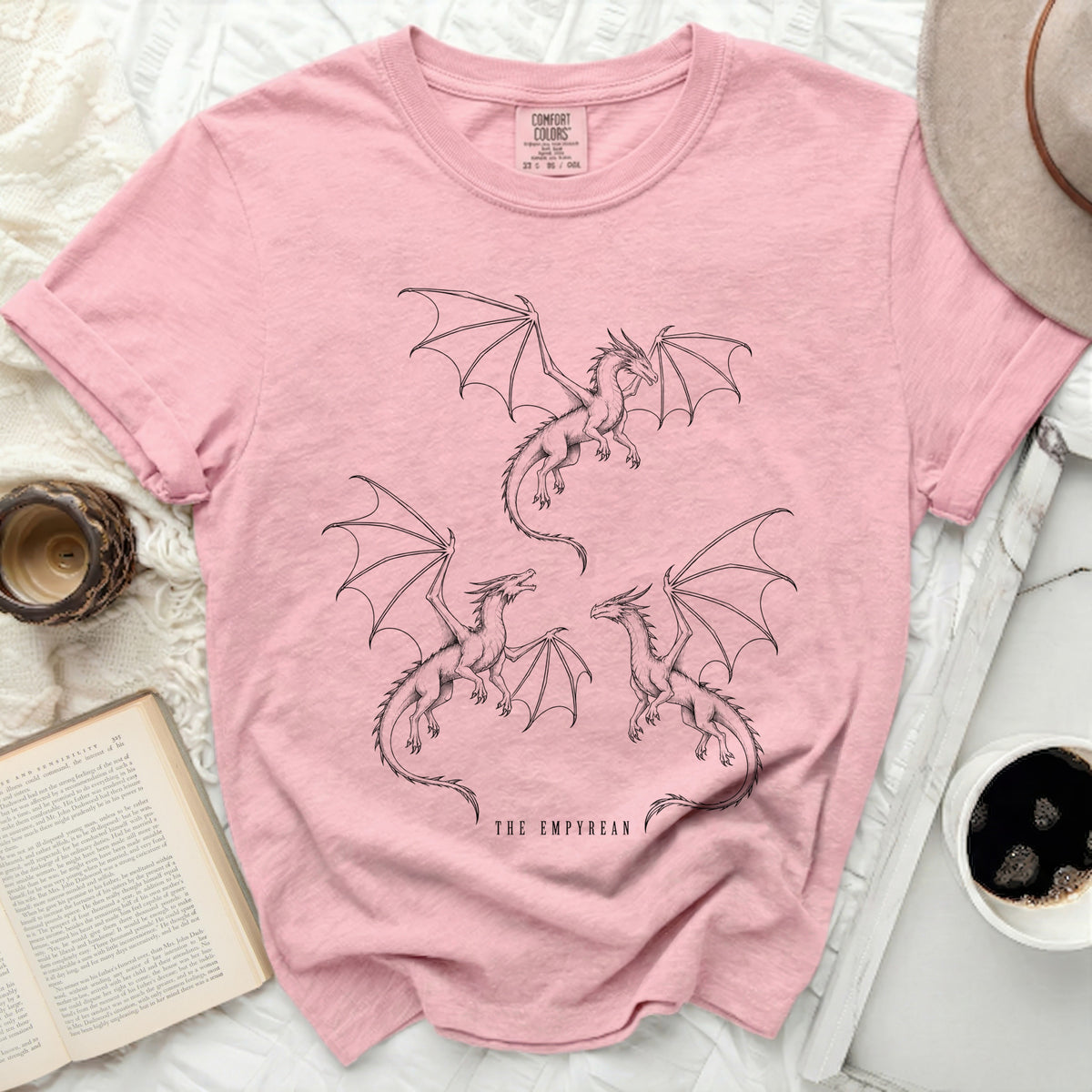 Pink t-shirt with three dragon illustrations and "THE EMPYREAN" text.