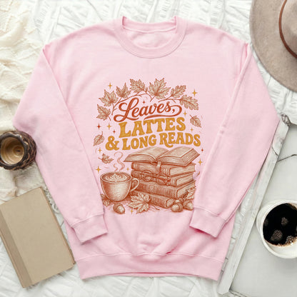 Pink sweatshirt with "Leaves, Lattes & Long Reads" text and autumnal illustrations.