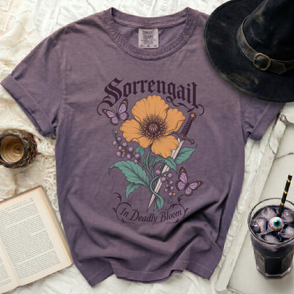 Purple t-shirt with Sorrengail graphic: flower, sword, berries, and butterflies.