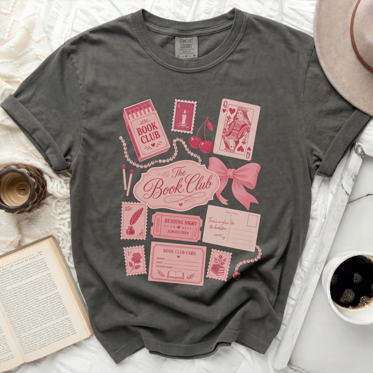 Dark grey t-shirt with pink book club themed graphics and text.
