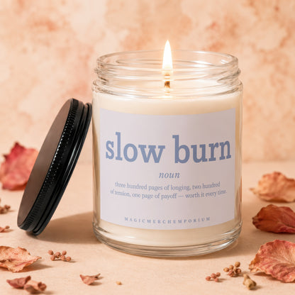 Scented candle with "slow burn noun" text and its definition.