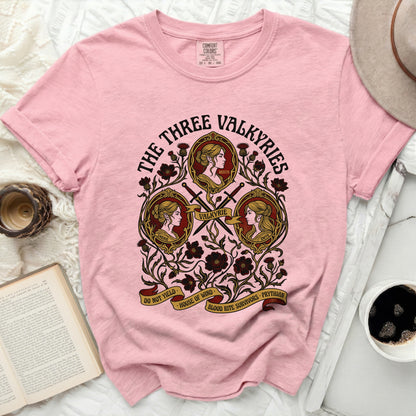 The Three Valkyries graphic on a pink Comfort Colors t-shirt with text.