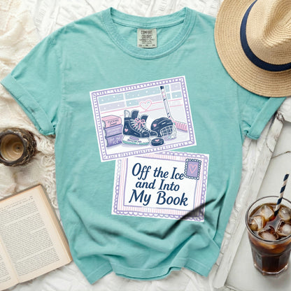 Teal t-shirt with a graphic of ice skates, hockey gear, and text.
