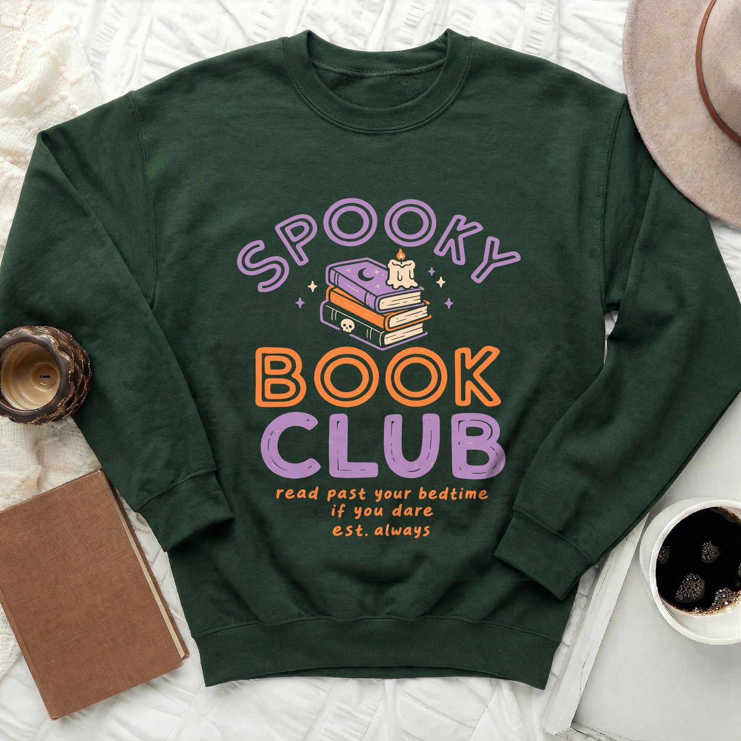 Green sweatshirt with "Spooky Book Club" text and Halloween-themed book art.