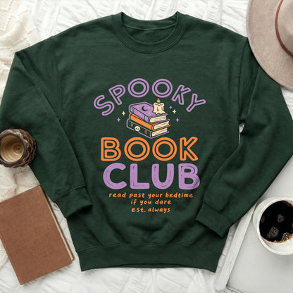 Green sweatshirt with "Spooky Book Club" text and Halloween-themed book art.