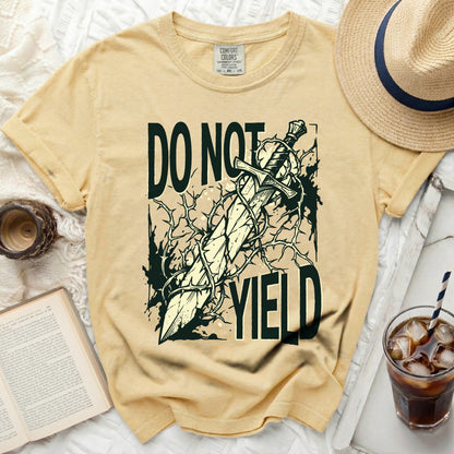"Do Not Yield" graphic with sword and thorns on a yellow t-shirt.