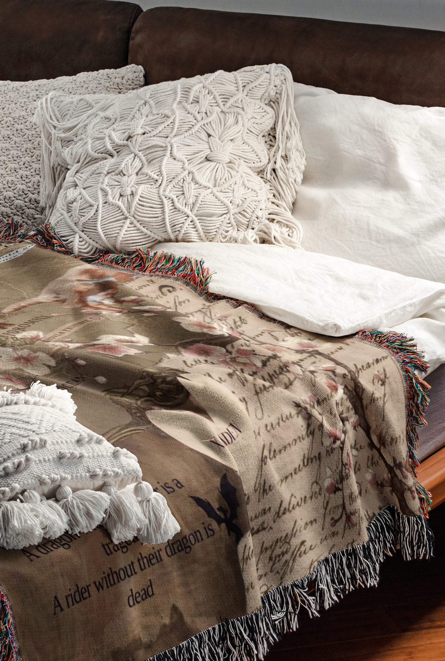 a cozy and inviting bedroom scene, featuring a bed with a brown blanket and white pillows, as well as a brown leather couch. The bed is adorned with a white and brown patterned blanket, and the couch has a brown leather cushion. The overall color scheme and arrangement create a warm and comfortable atmosphere.