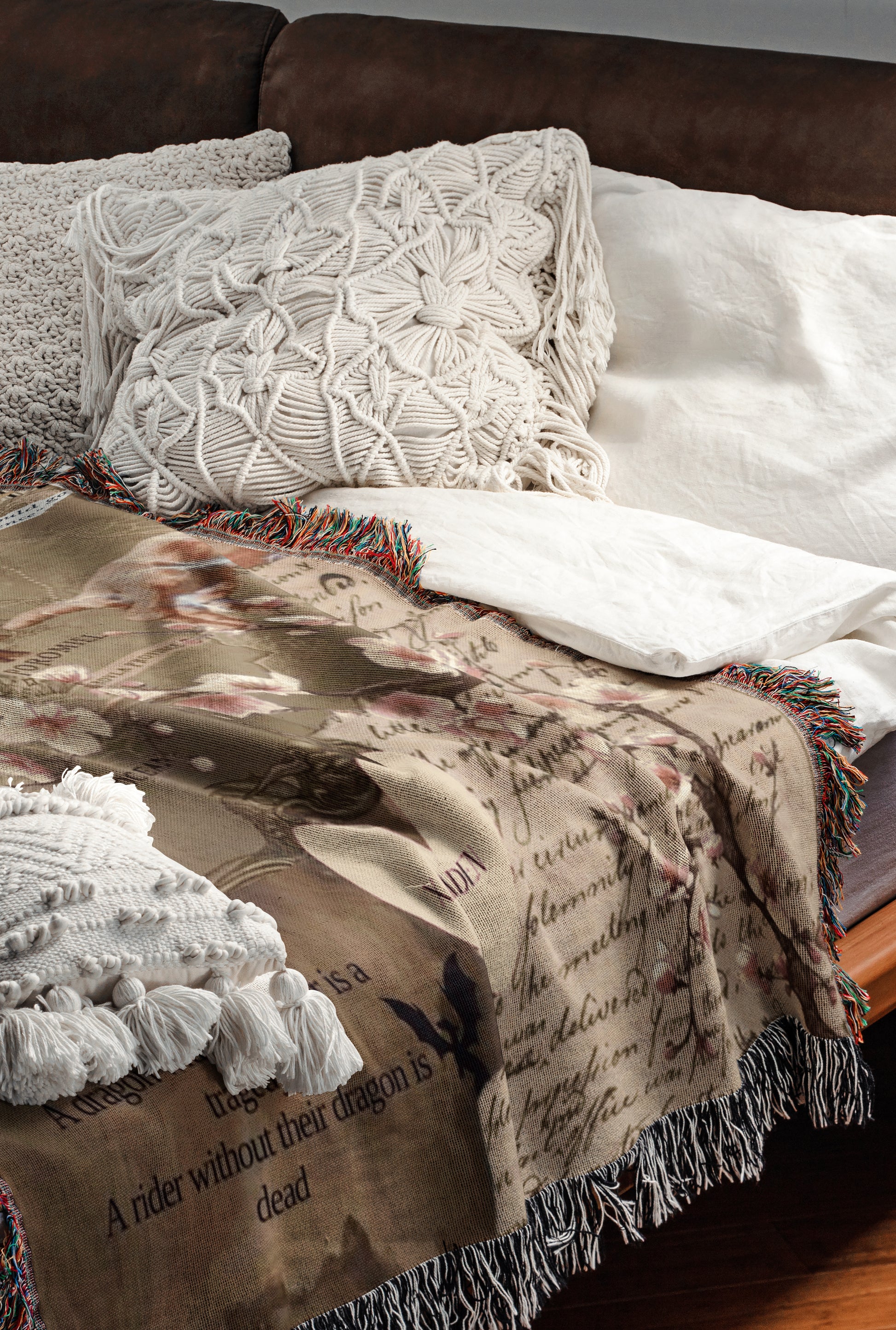 a cozy and inviting bedroom scene, featuring a bed with a brown blanket and white pillows, as well as a brown leather couch. The bed is adorned with a white and brown patterned blanket, and the couch has a brown leather cushion. The overall color scheme and arrangement create a warm and comfortable atmosphere.