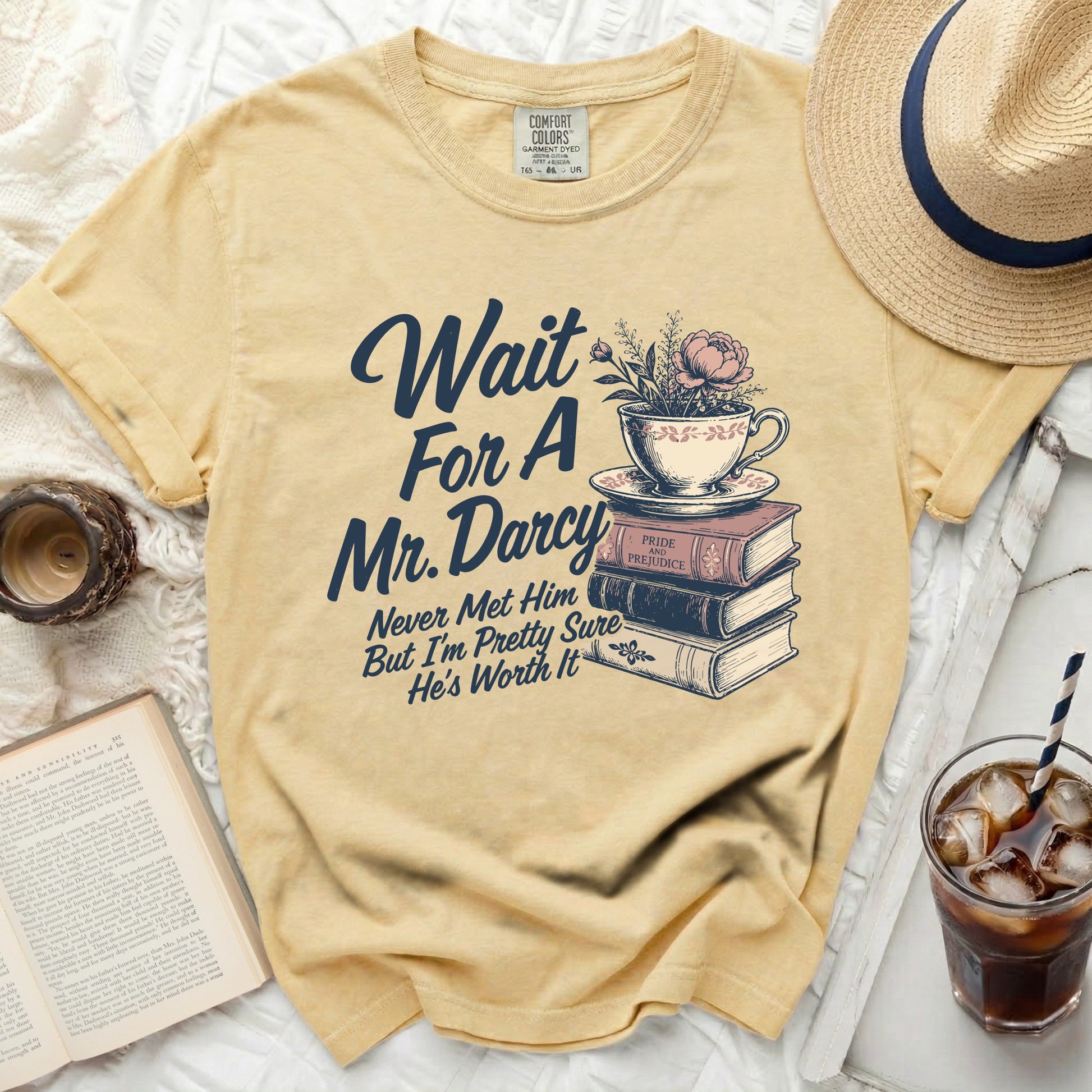 Yellow t-shirt with "Wait For A Mr. Darcy" and graphic on it.