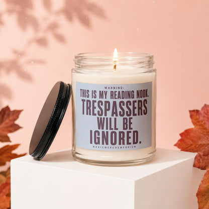 Glass jar candle with label reading "Warning: This is my reading nook. Trespassers will be ignored."