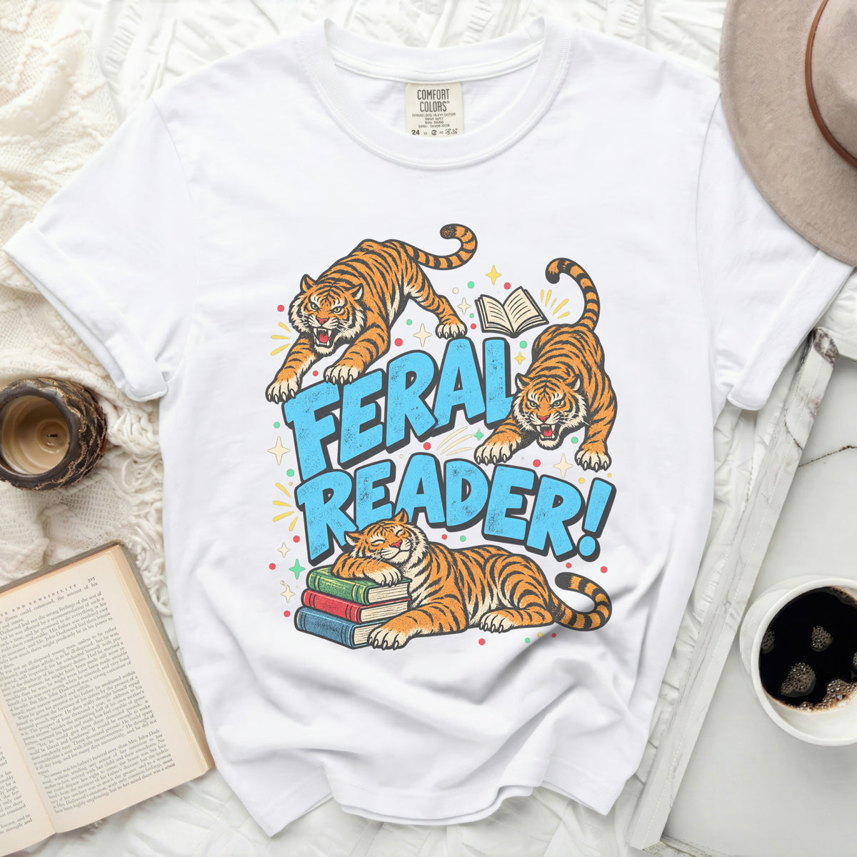 White t-shirt with three tigers and text reading "FERAL READER!".