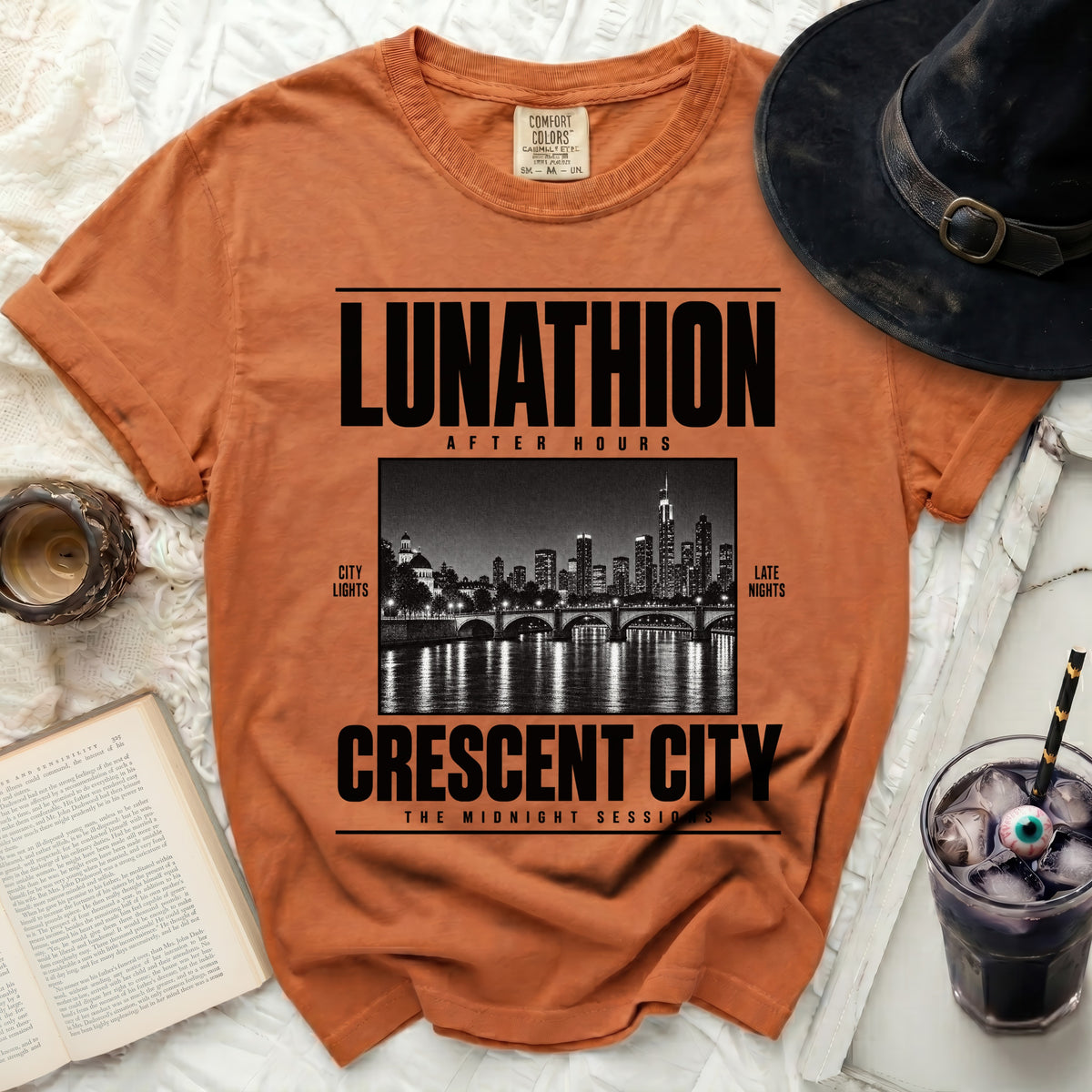 Orange t-shirt with "LUNATHION AFTER HOURS CRESCENT CITY THE MIDNIGHT SESSIONS" graphic.