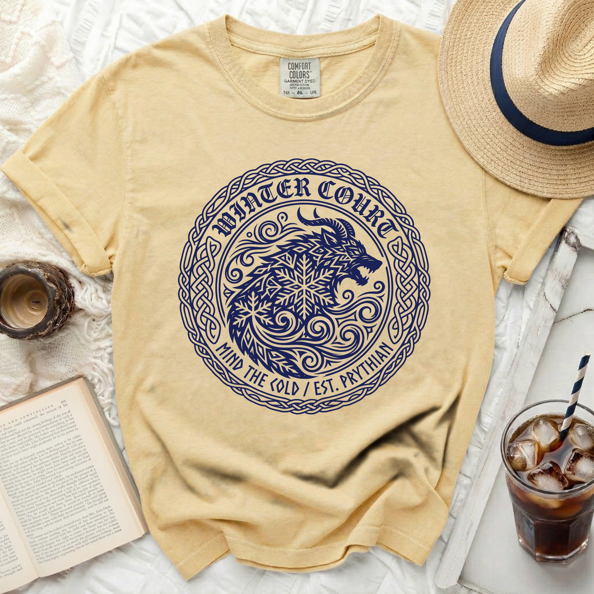 Yellow Comfort Colors t-shirt with a navy blue wolf and snowflake circular graphic.