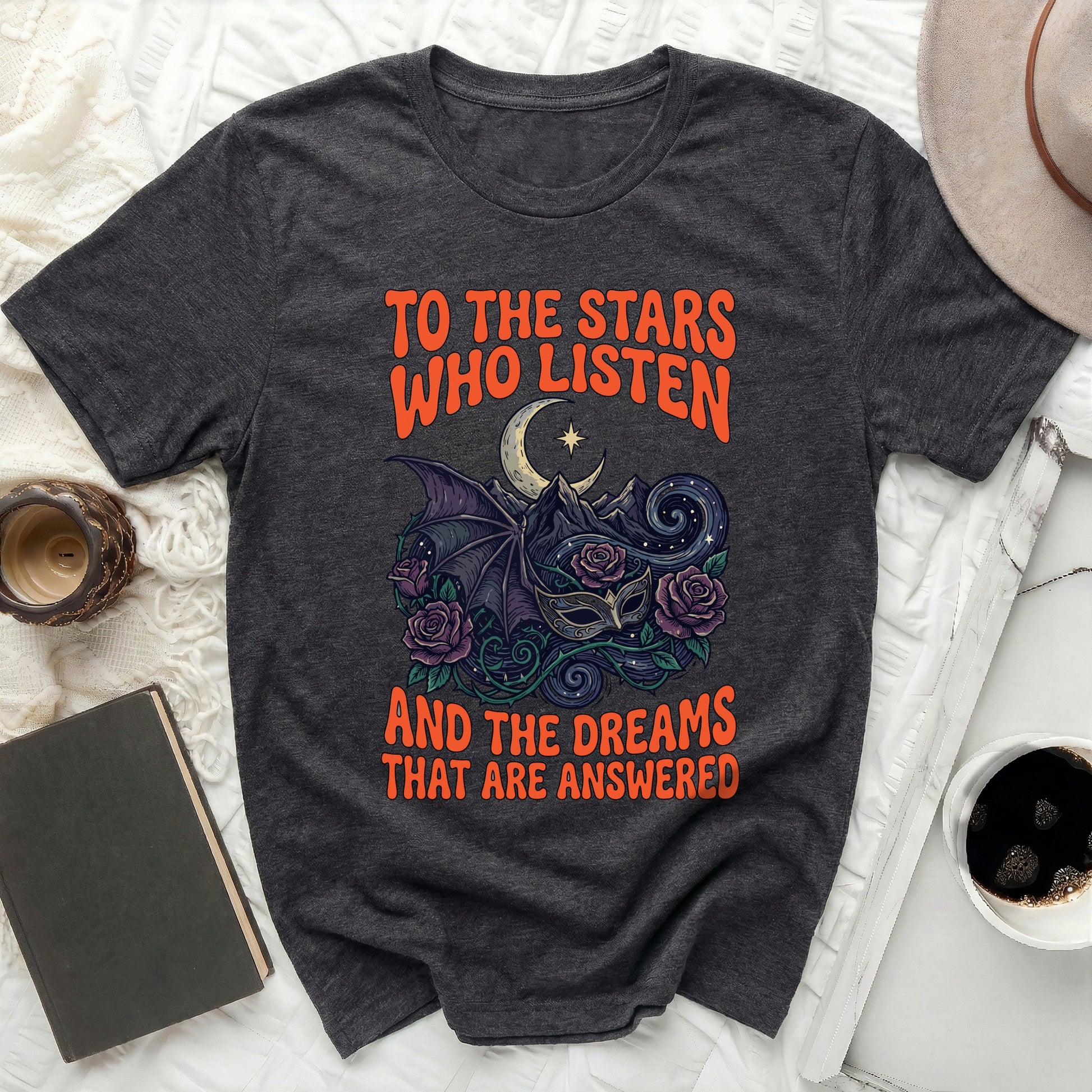 TO THE STARS WHO LISTEN AND THE DREAMS THAT ARE ANSWERED product type
Celestial Shirt, Moon Star Design, Fantasy Graphic, Bat Wing Mask, Rose Artwork, Dark Aesthetic, Gothic Apparel, Mystical Print, Quote T-Shirt, Literary Fan, Book Lover Gift, Night Sky Art, Unique T-Shirt, Trendy Fashion, Unisex Top, Comfort Tee, Statement Shirt, Dark Academia, Magic Theme, Enchanted Dreams