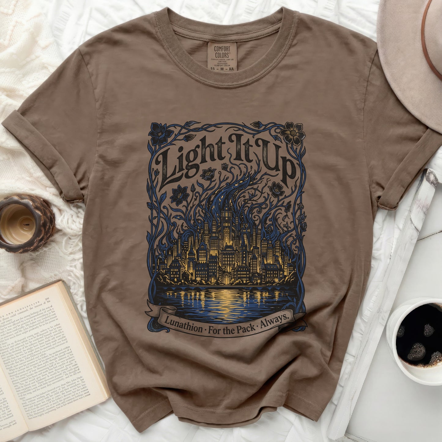 Brown t-shirt with "Light It Up Lunathion. For the Pack. Always." graphic.