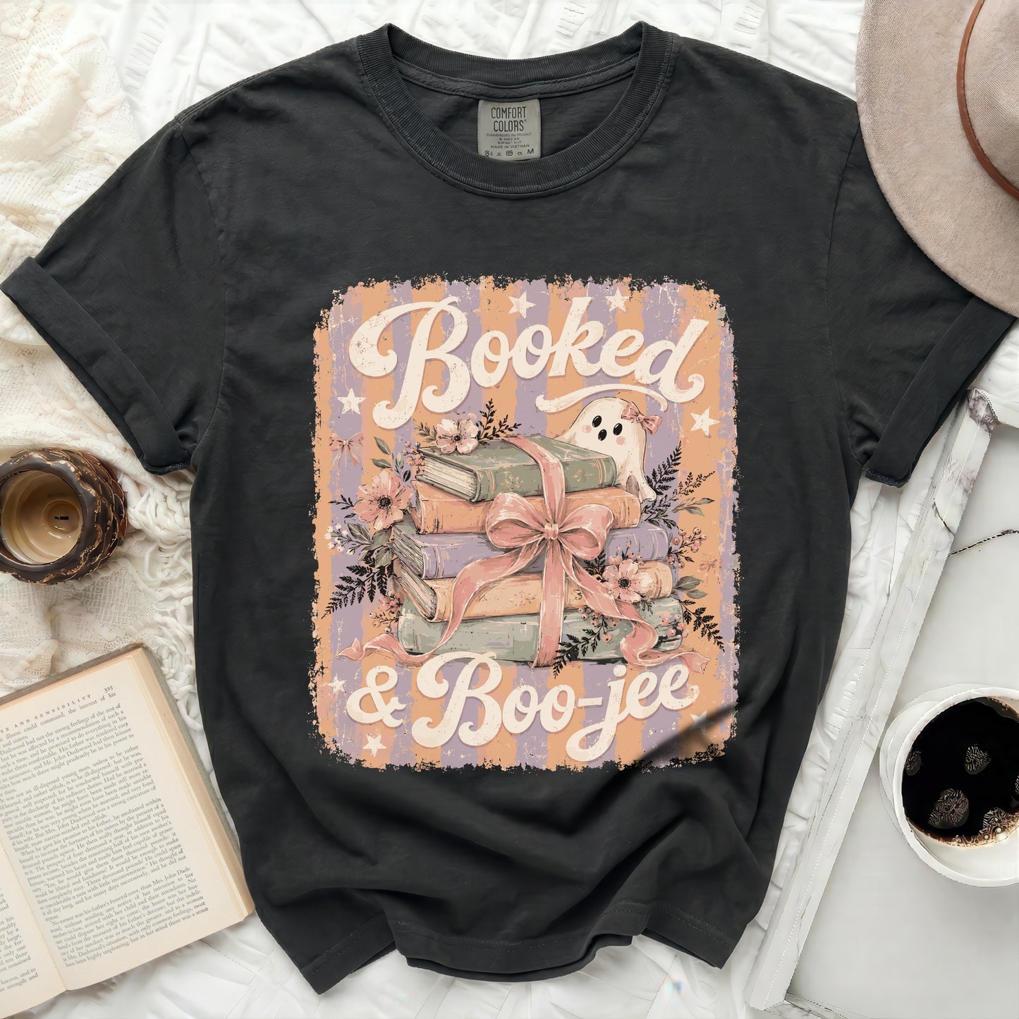 Dark t-shirt with "Booked & Boo-jee" text featuring a ghost and stack of books.