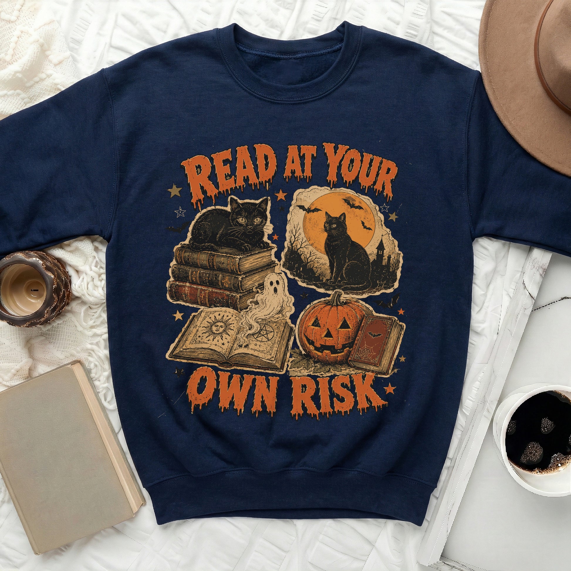 Navy sweatshirt with Halloween-themed graphic reading "READ AT YOUR OWN RISK".