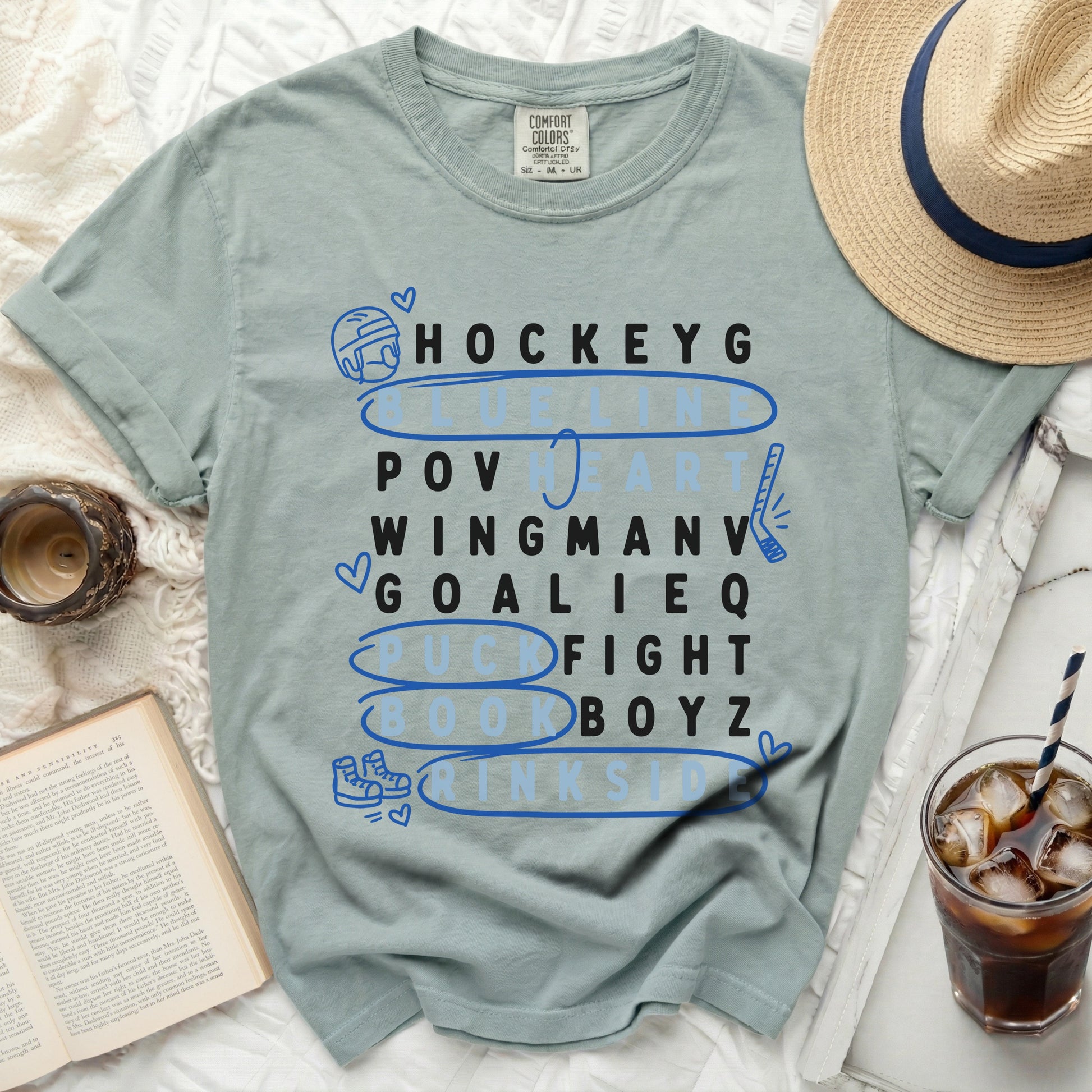 T-shirt with hockey-themed word art: Hockey, Pov, Wingman, Goalie, Puck Fight, Book Boyz.