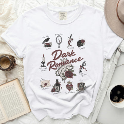 T-shirt with dark romance theme featuring roses, skulls, keys, and potion bottles.