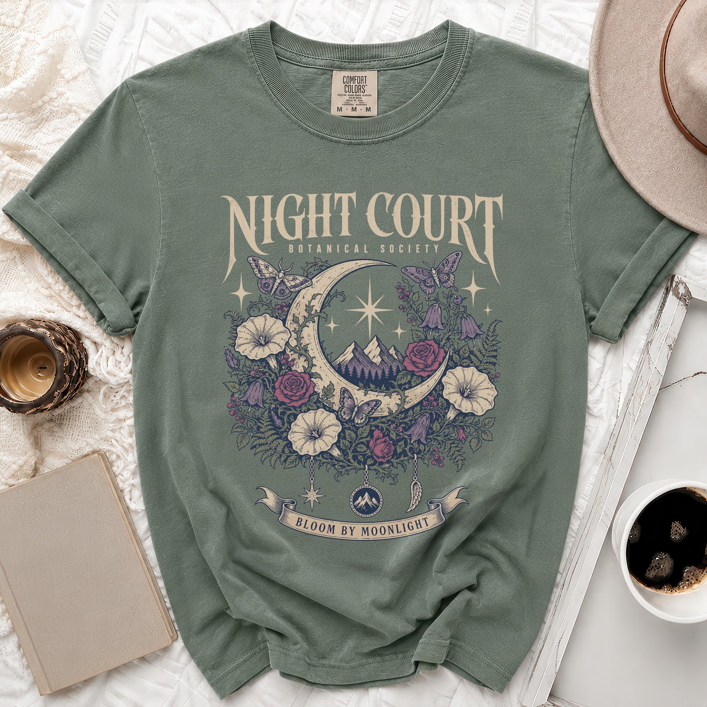 Green t-shirt with "Night Court Botanical Society" and a crescent moon with floral and butterfly design.