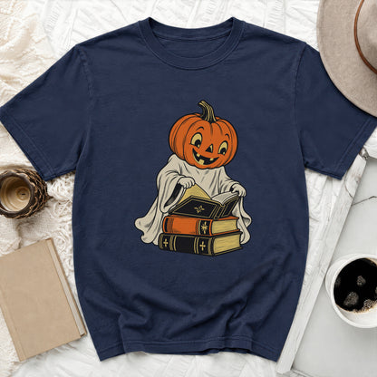 Navy t-shirt with cartoon pumpkin ghost reading a stack of vintage books.