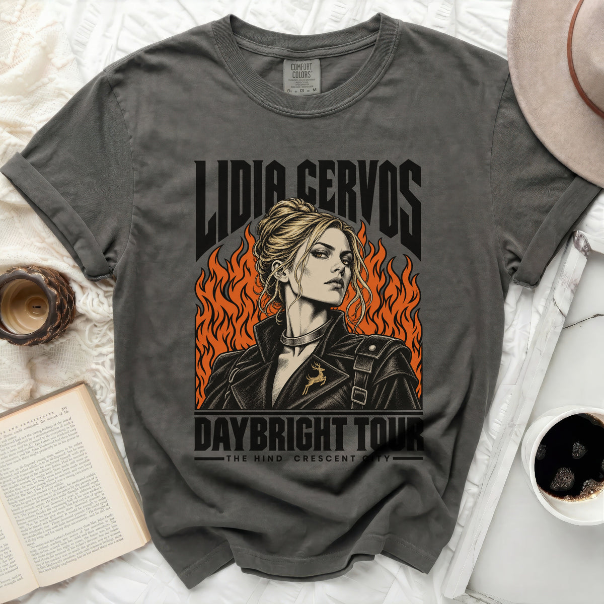 Lidia Cervos Daybright Tour graphic t-shirt with flames and a deer pin.