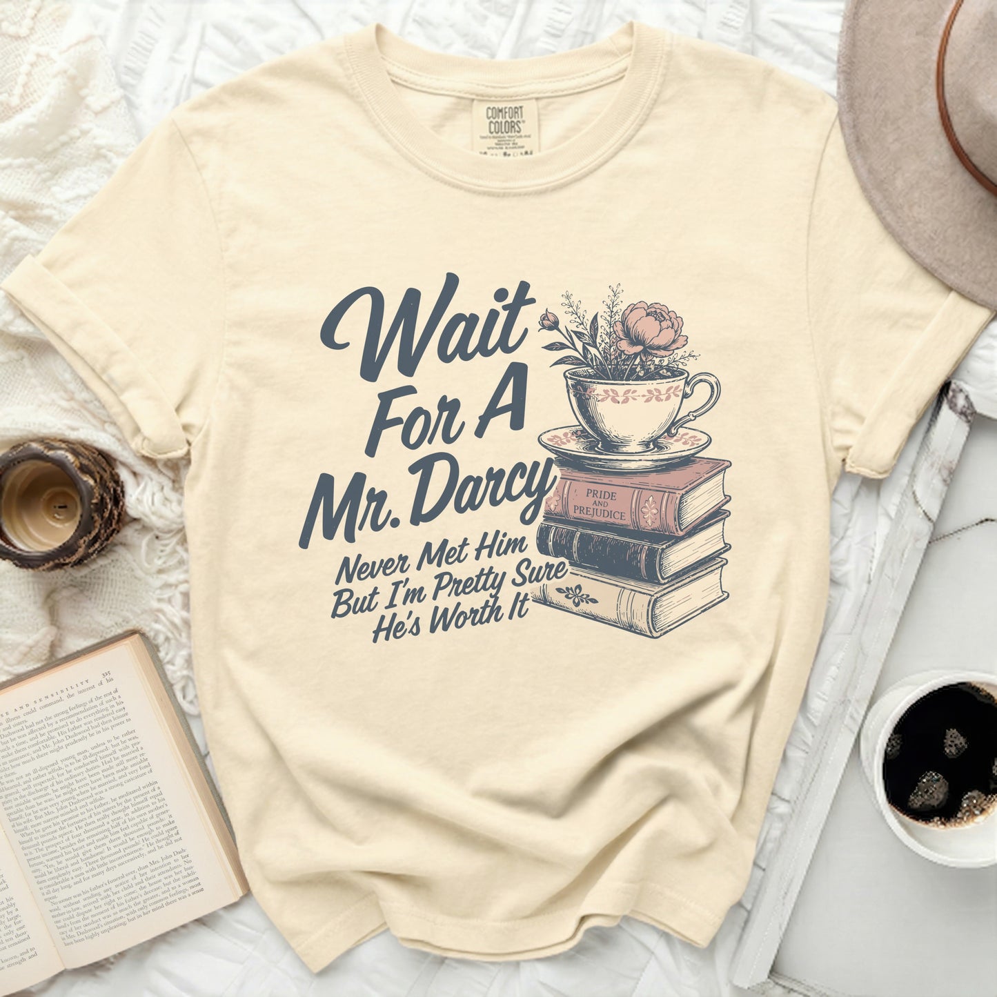 Cream t-shirt with graphic: Wait For A Mr. Darcy, Never Met Him But I'm Pretty Sure He's Worth It.