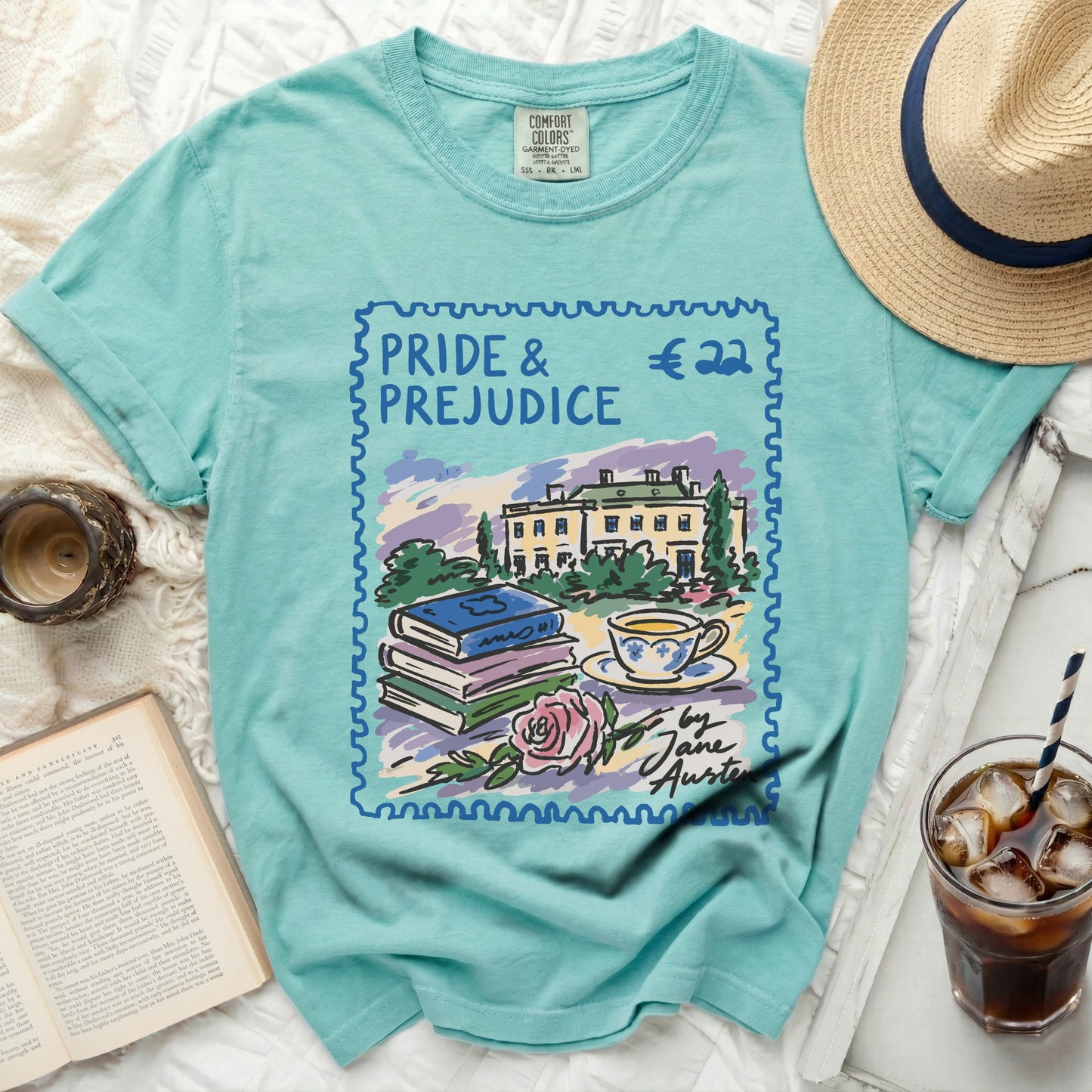 "Pride & Prejudice" graphic t-shirt with books, teacup, and rose.